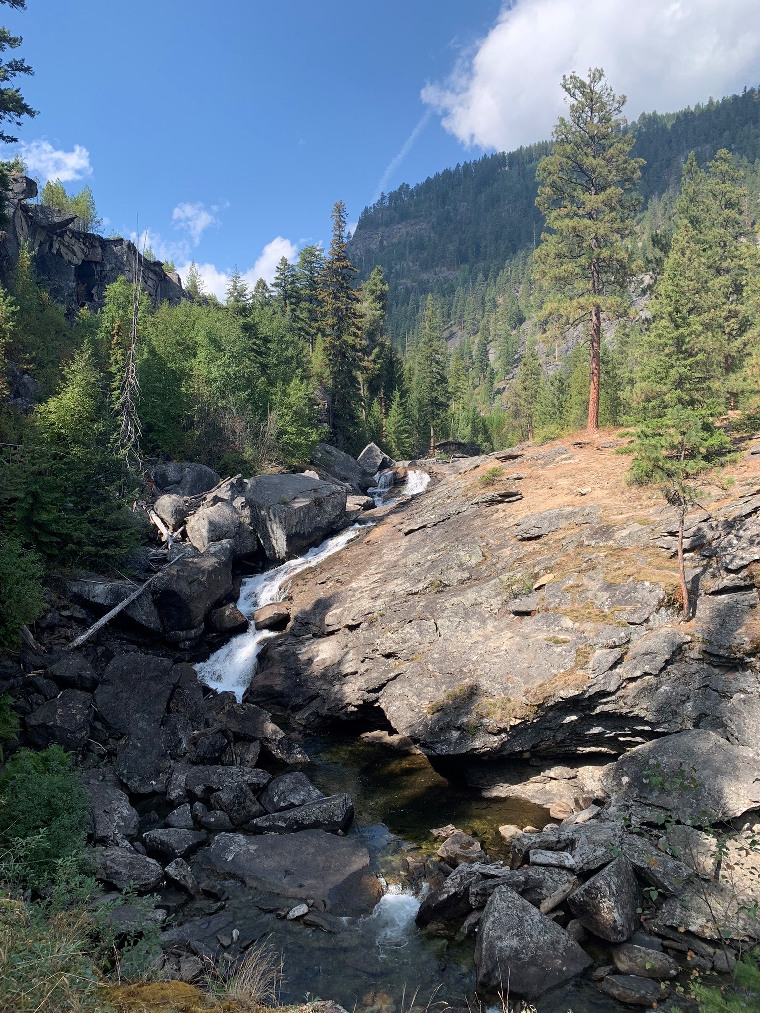 Rock and mountain landscape with creek running through