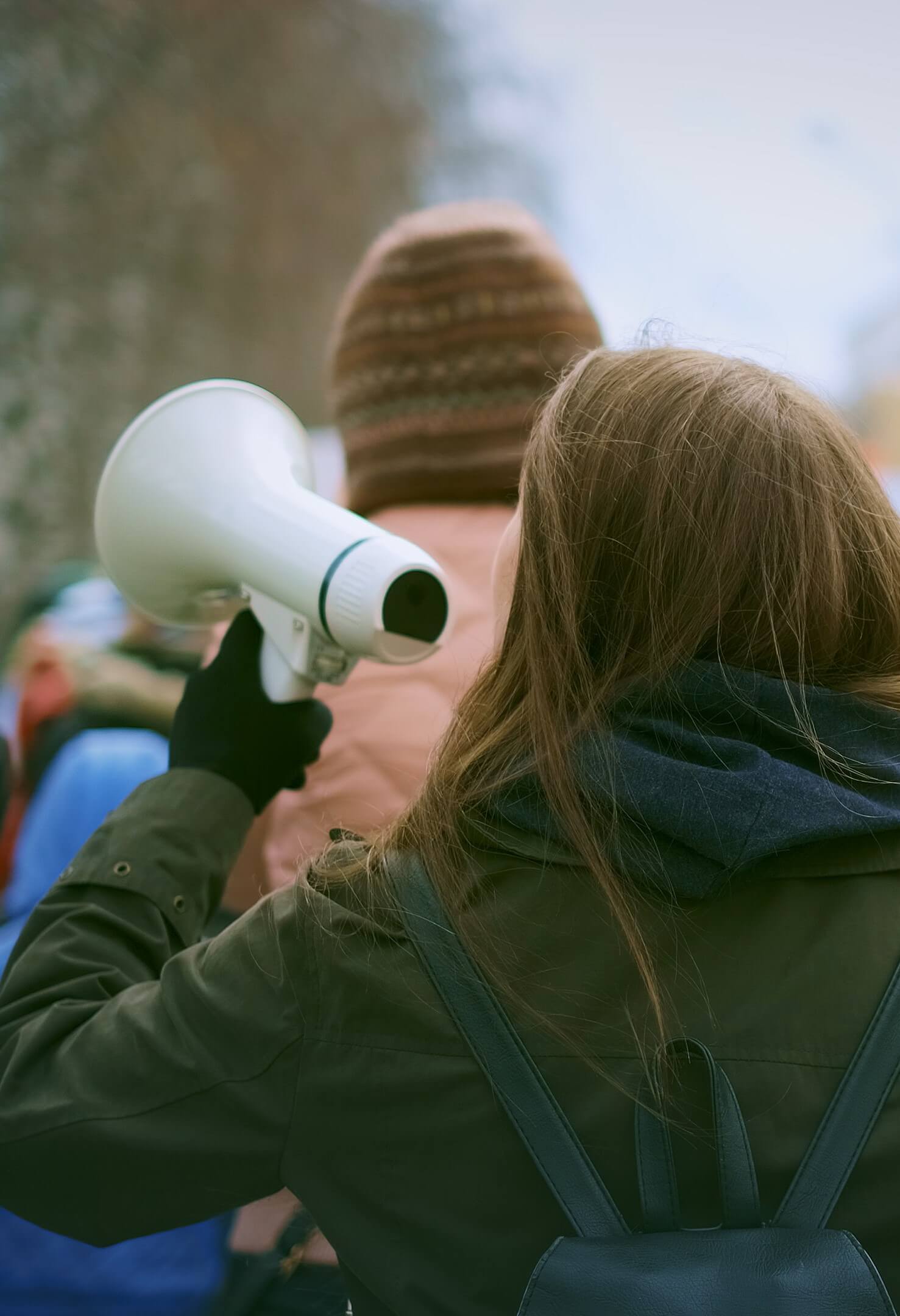A girl holds a megaphone